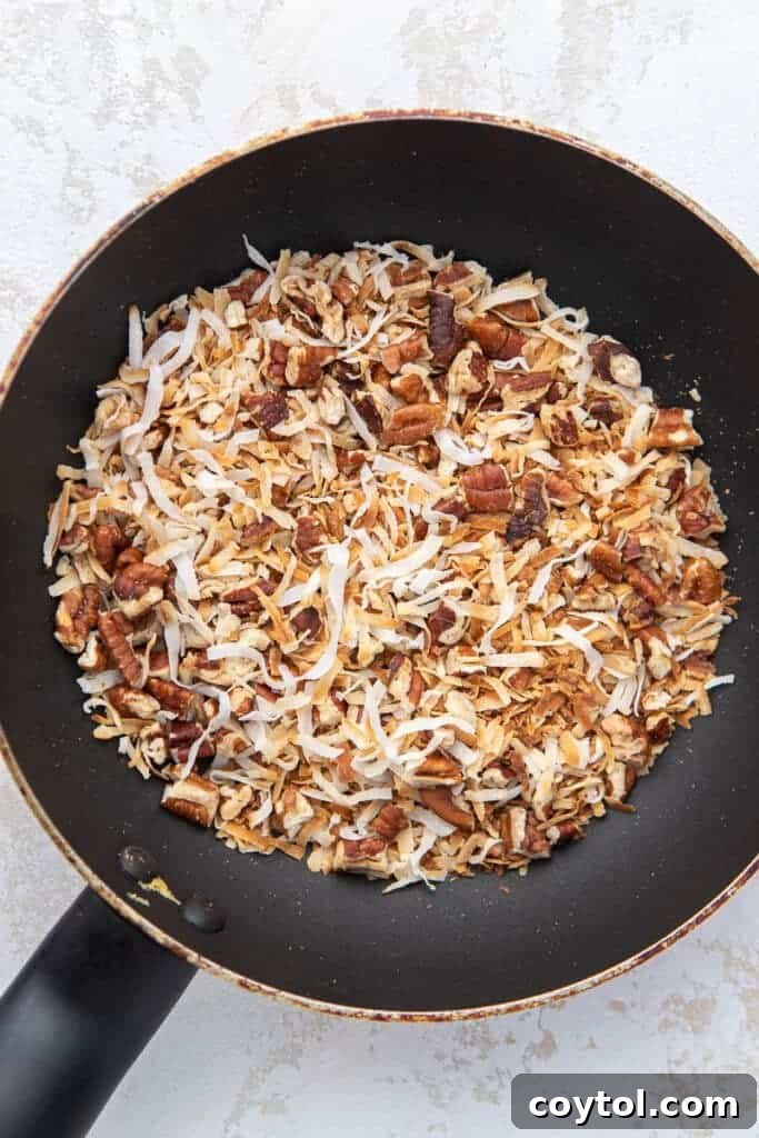 Toasted coconut flakes and pecans, a key component for the German chocolate cake frosting.