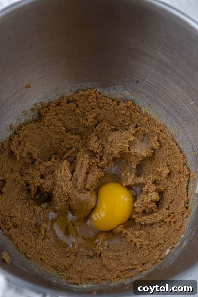 Creamed butter, sugar, and egg mixture, showing the initial stage of cookie dough preparation.