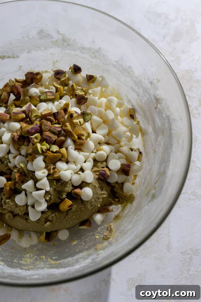 Pistachio cookie dough mixed with white chocolate chips.