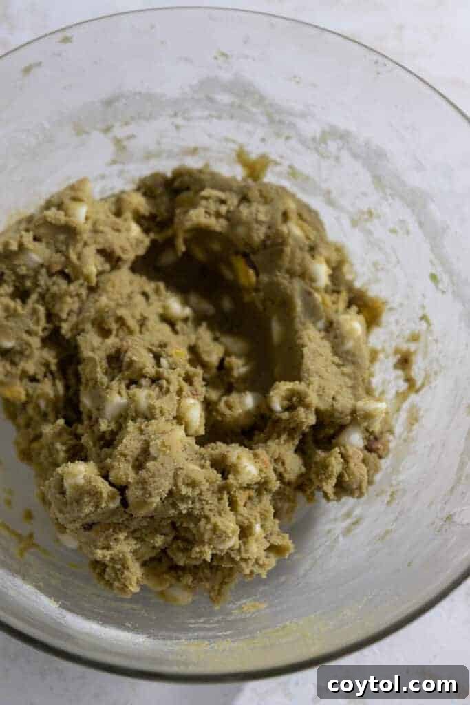 Close-up of pistachio pudding cookie dough with rich green color.
