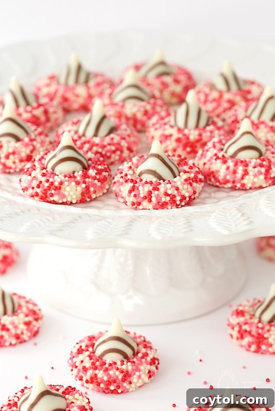 18 Irresistible Valentine's Day Cookie Ideas 27 Charming easy Valentine's shortbread cookies, coated with pink sprinkles and topped with Hershey's Hugs.
