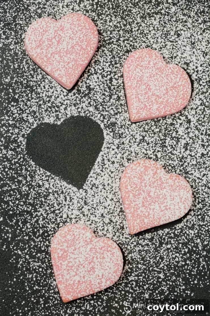 18 Irresistible Valentine's Day Cookie Ideas 28 Heart-shaped pink sugar cookies lightly dusted with powdered sugar, a clean and stunning finish for Valentine's Day.