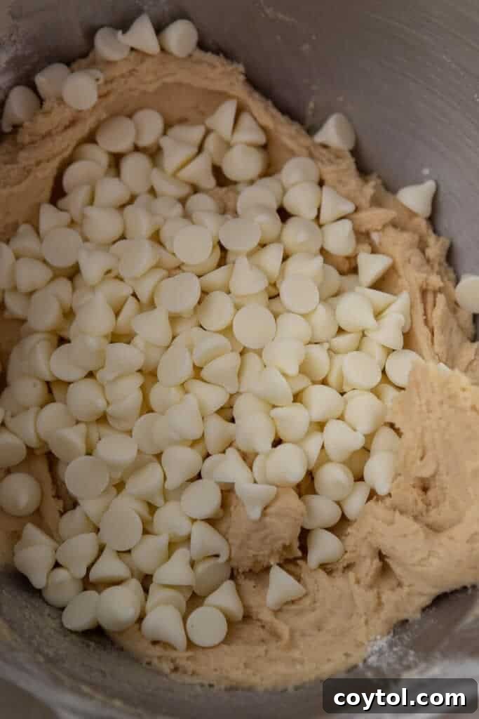 White chocolate chip cookie dough in mixing bowl