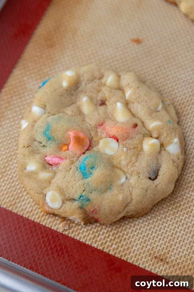 Crumbl lucky charms cookie in a baking sheet
