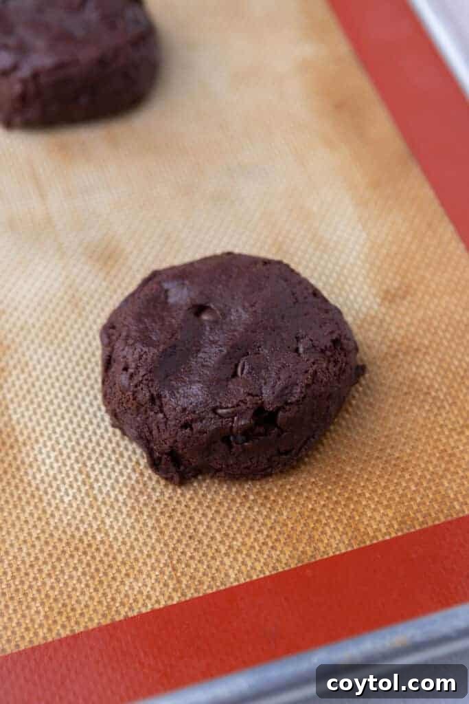 chocolate chip brownie cookie dough on baking sheet