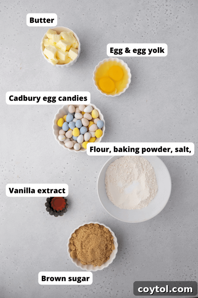 Various ingredients for baking Easter Mini Egg Blondies laid out on a surface
