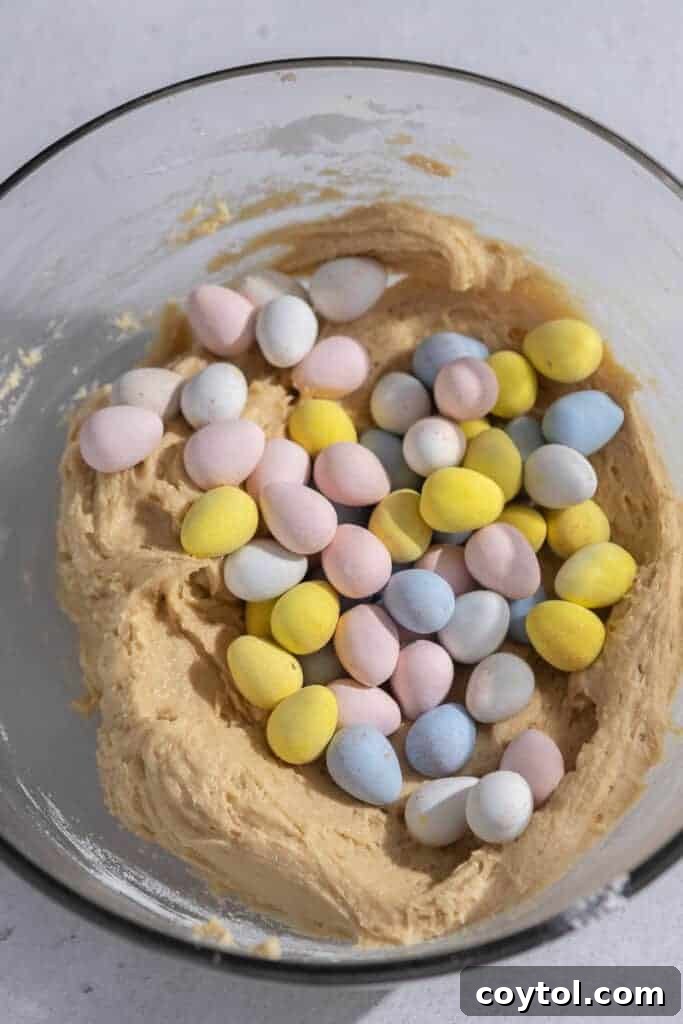 Smooth blondie batter with wet ingredients combined in a mixing bowl