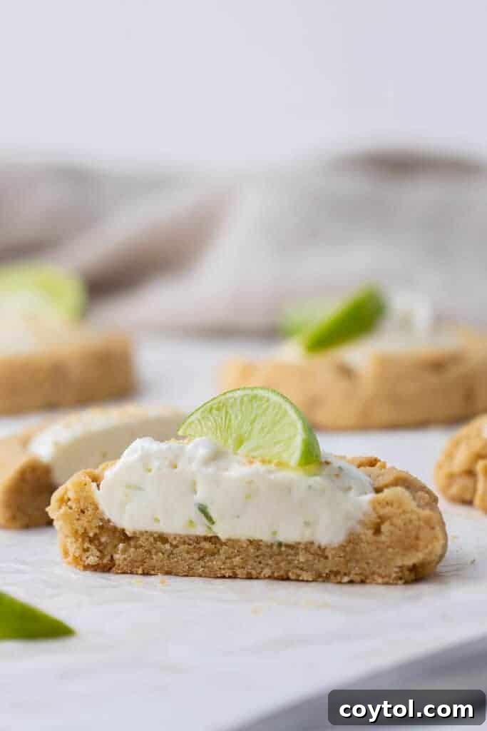 Key Lime Pie Cookie cut in half, revealing creamy filling