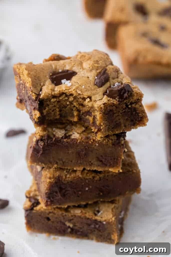 Irresistible Brown Butter Chocolate Chip Blondies 2 Stack of brown butter blondies, showcasing their golden-brown edges and fudgy interior