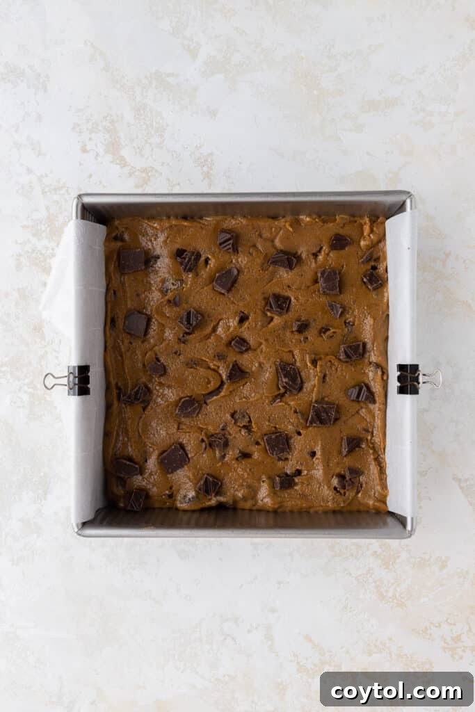 Irresistible Brown Butter Chocolate Chip Blondies 12 brown butter blondie batter spread in an 8x8 pan