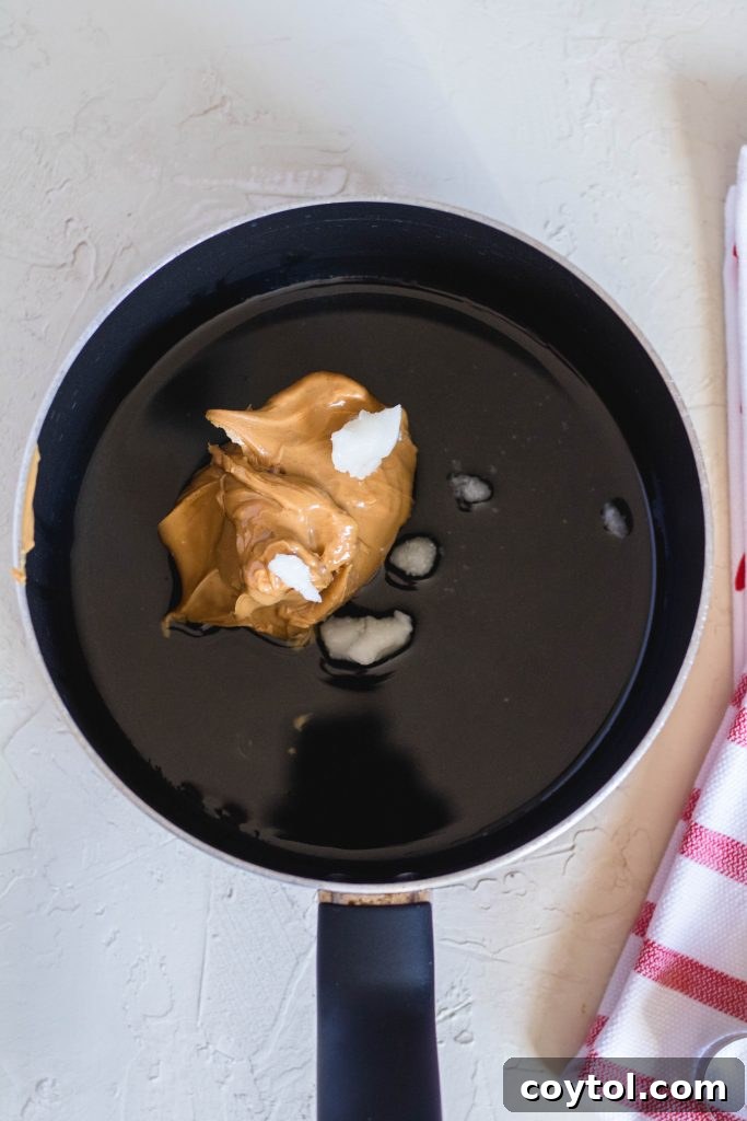 Heart-Healthy No-Bake Valentine's Delights 11 Coconut oil and peanut butter melting in a saucepan