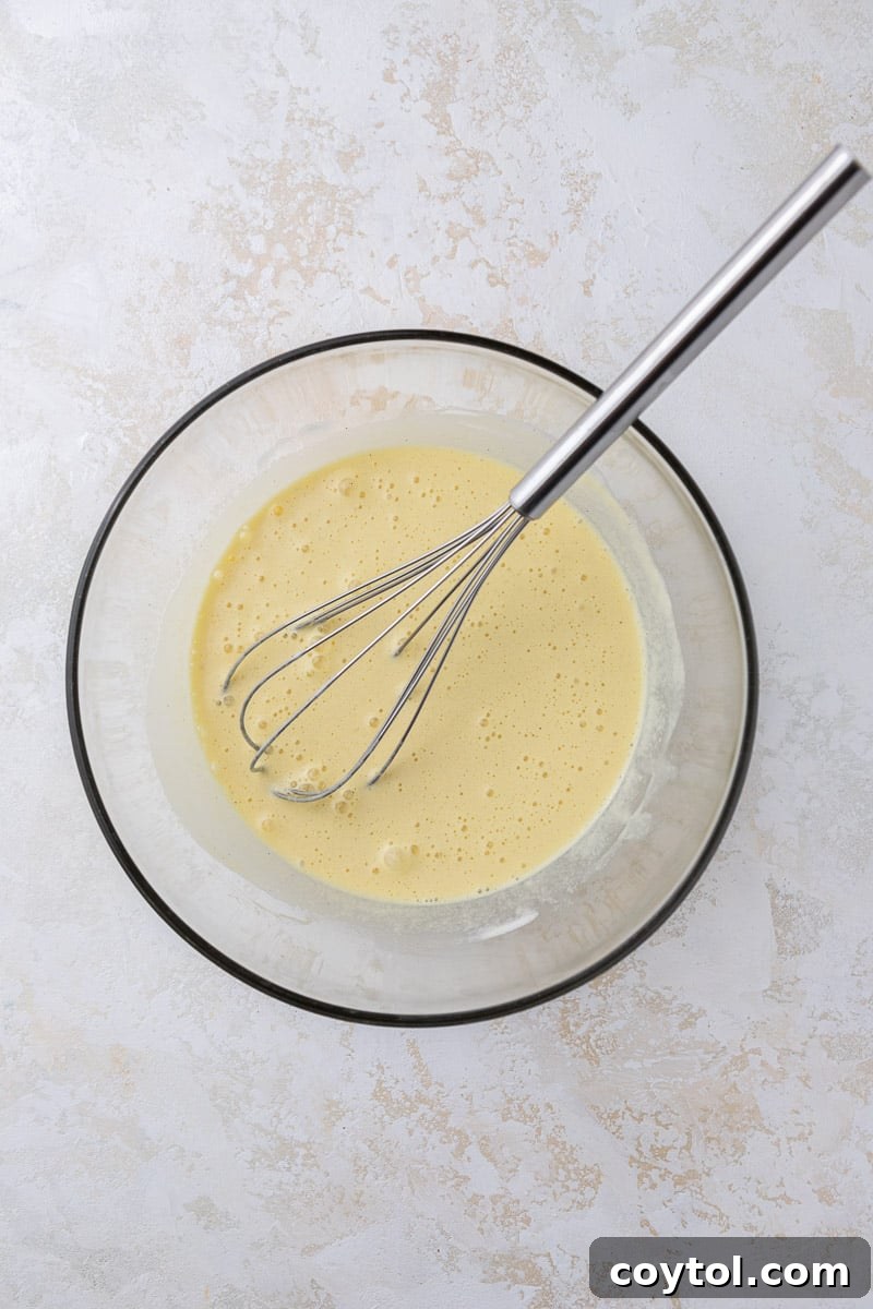 Effortless Indulgence: 3-Ingredient Creme Brulee & Ice Cream 7 Smooth custard batter in a bowl, ready to be poured into ramekins