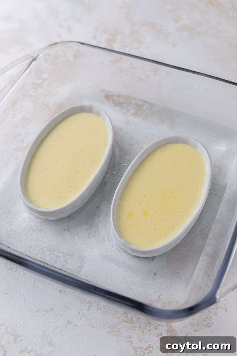 Effortless Indulgence: 3-Ingredient Creme Brulee & Ice Cream 8 Creme brulee ramekins in a water bath, baking in the oven for a gentle set