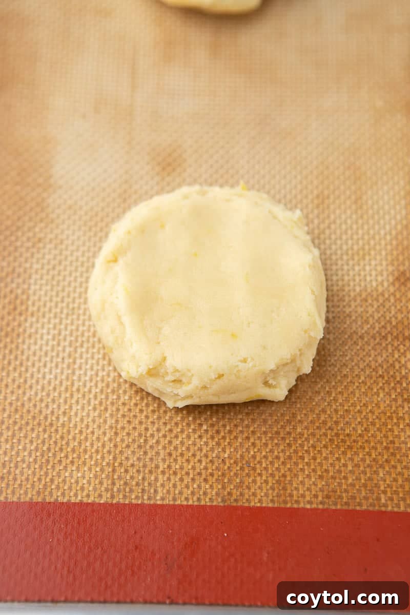 Zesty Chilled Lemon Bar Cookies 8 flattened cookie dough on baking sheet ready for baking