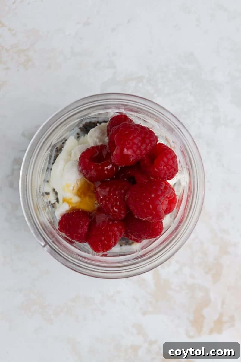 Ingredients for overnight oats in a measuring cup, showcasing readiness for mixing.