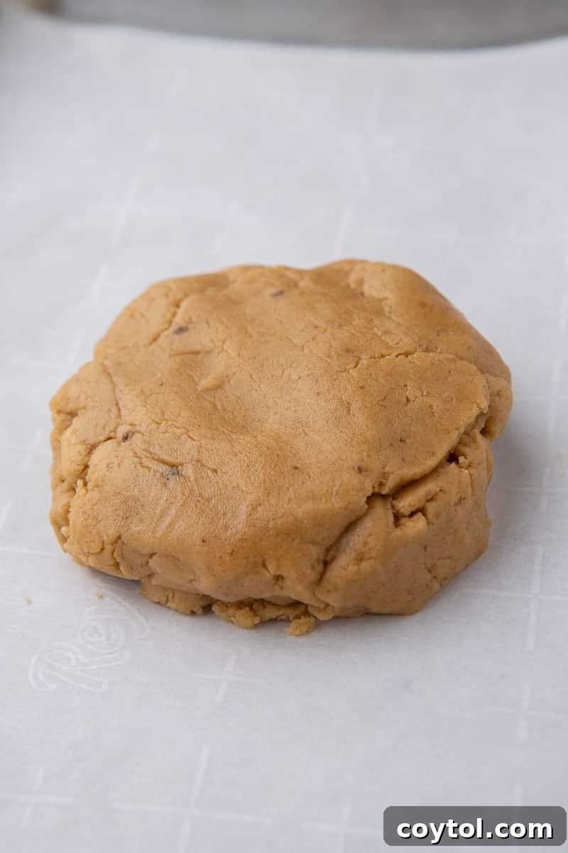 Peanut butter cookie dough ready on a baking sheet