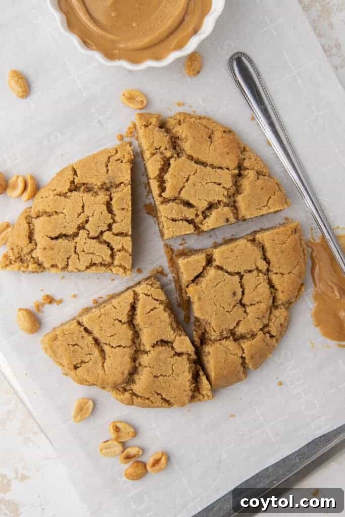 Peanut butter cookie for one, elegantly quartered on a plate