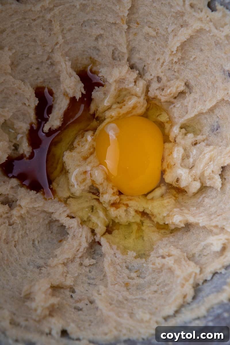 Blueberry Muffin Cookie Bliss: Crumbl-Style with Streusel 5 Creamed sugar and egg in mixing bowl for cookies