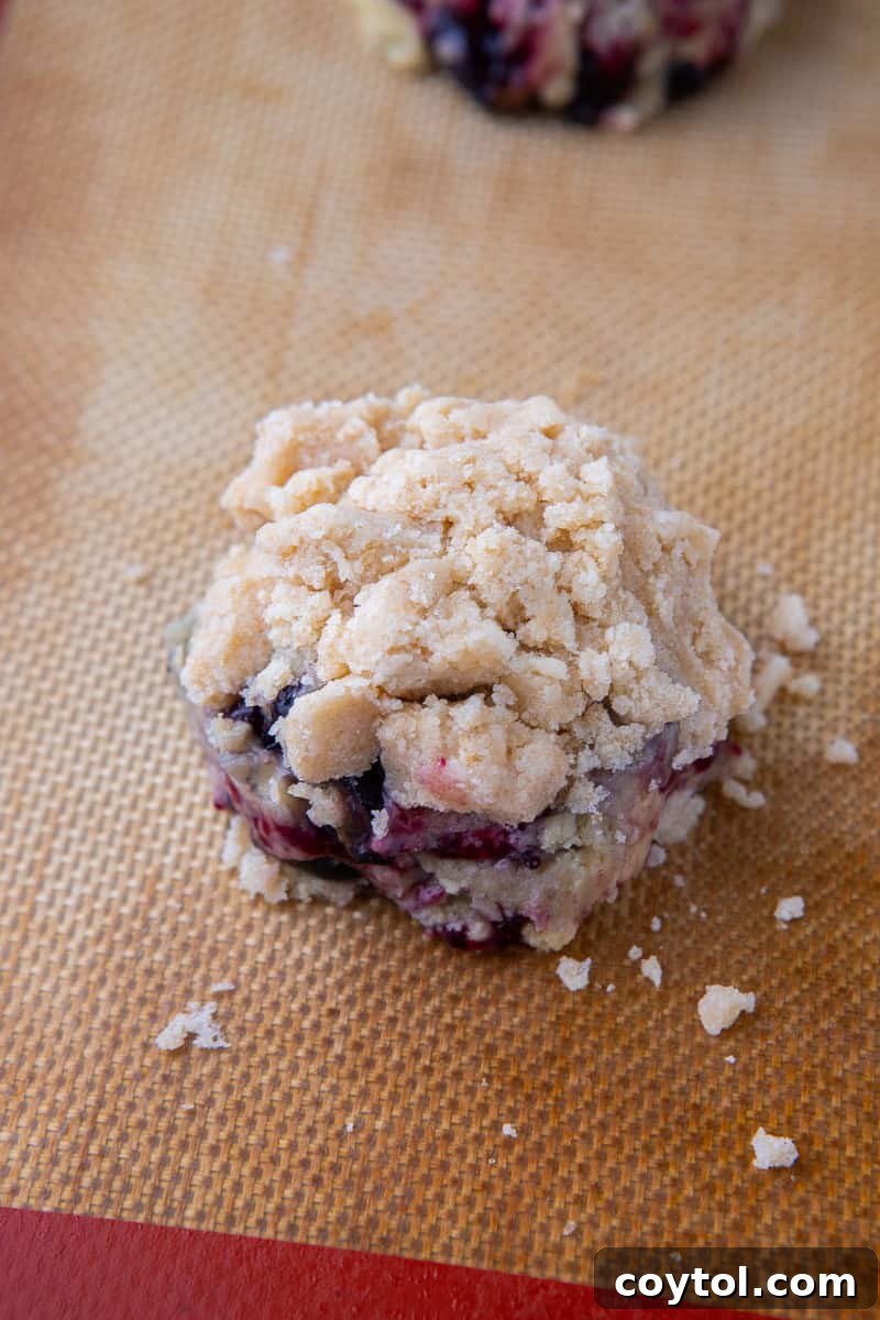 Blueberry Muffin Cookie Bliss: Crumbl-Style with Streusel 9 Blueberry muffin cookie dough topped with streusel
