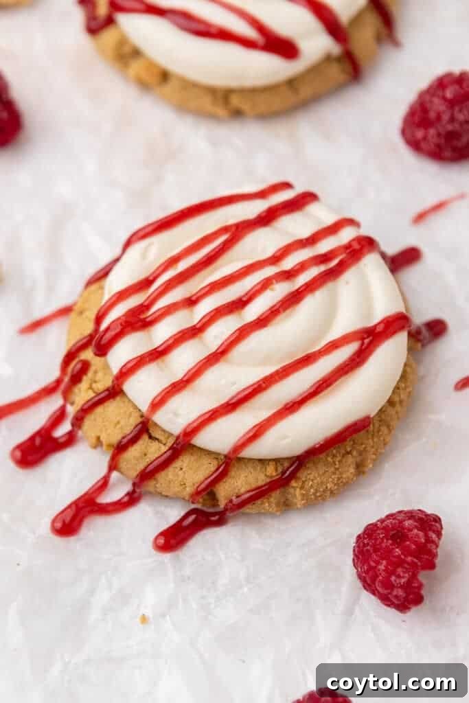 Irresistible Crumbl Raspberry Cheesecake Cookies 12 Close-up of a beautifully frosted Crumbl Raspberry Cheesecake Cookie