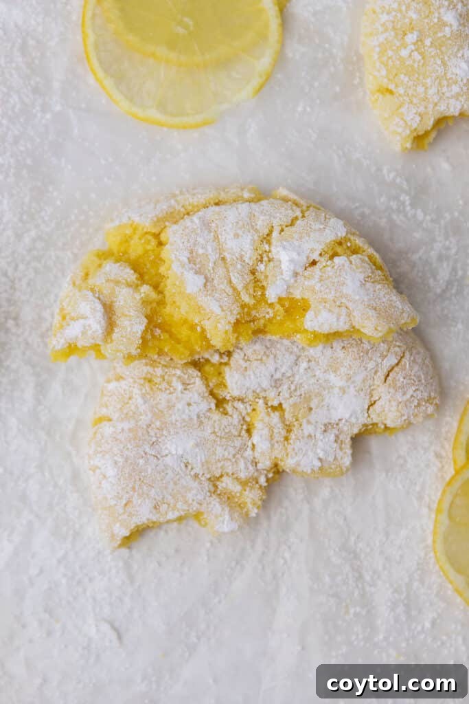 Small Crumbl lemon crinkle cookies on a white plate