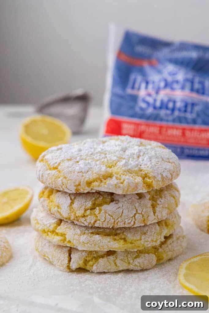 Stack of freshly baked lemon crinkle cookies on a wire rack