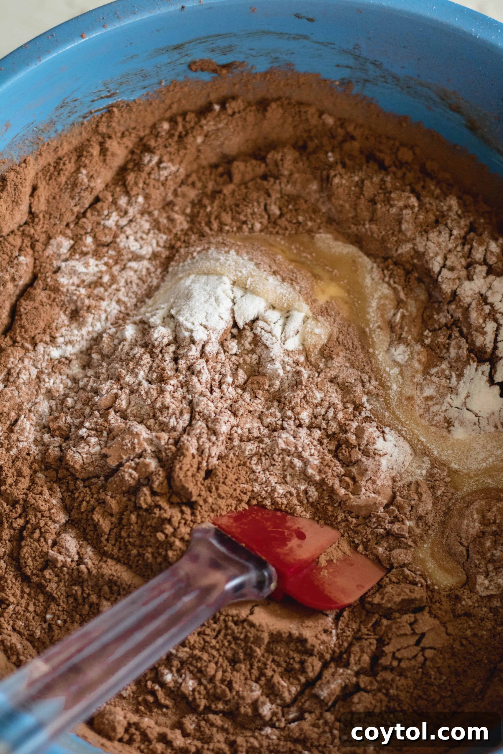 adding the dry ingredients to the brownie mix