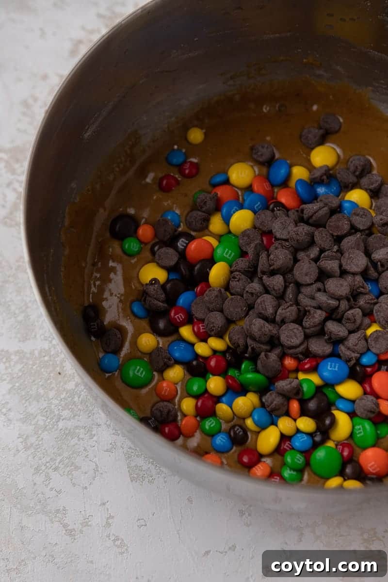 Chewy M&M Chocolate Chip Blondie Bars 6 Blondie batter after eggs and vanilla have been incorporated, showing a light and airy consistency