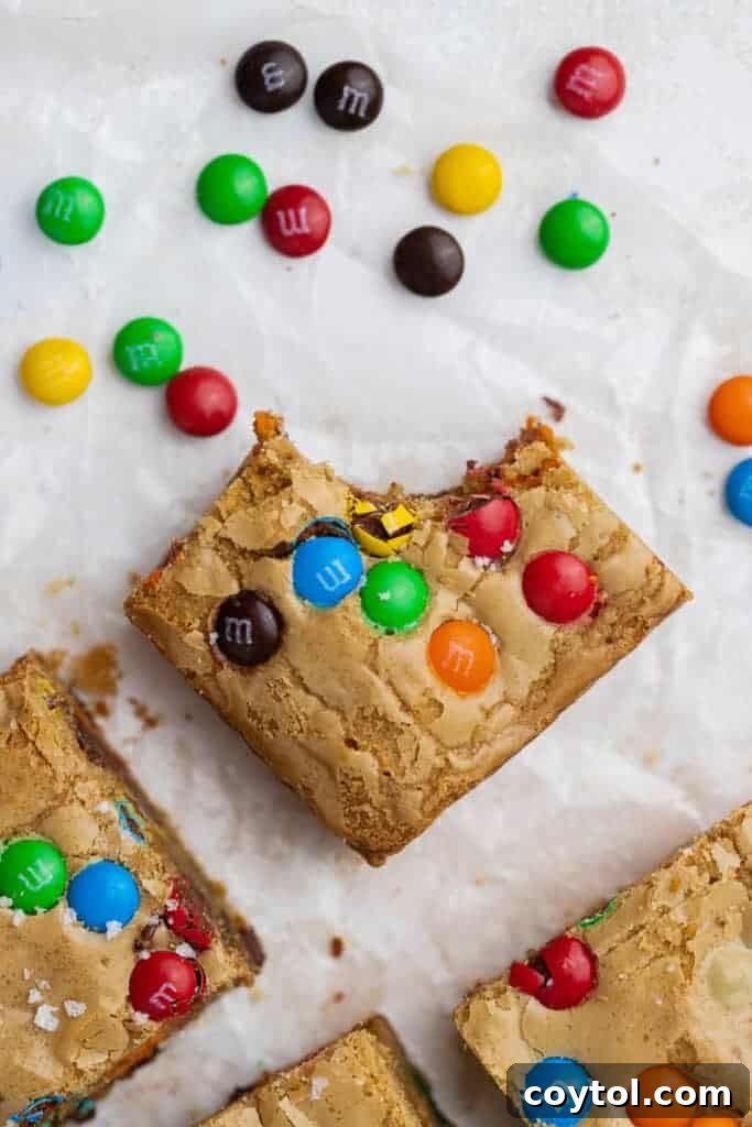 Chewy M&M Chocolate Chip Blondie Bars 9 Close-up of baked Chocolate Chip M&M Blondies, showing their vibrant colors and appealing texture