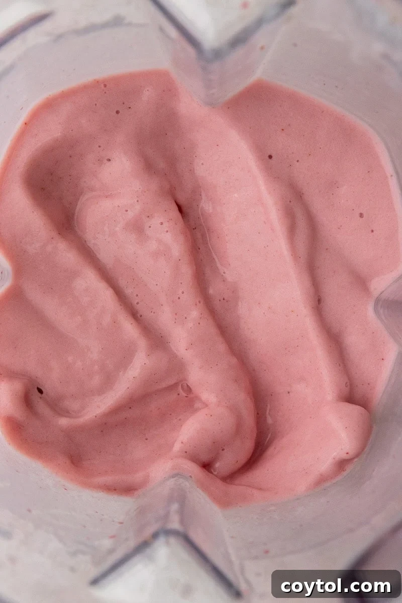 Blended strawberry banana smoothie in a Vitamix blender