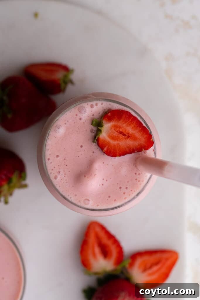 Overhead shot of two glasses of McDonald's strawberry banana smoothie copycat
