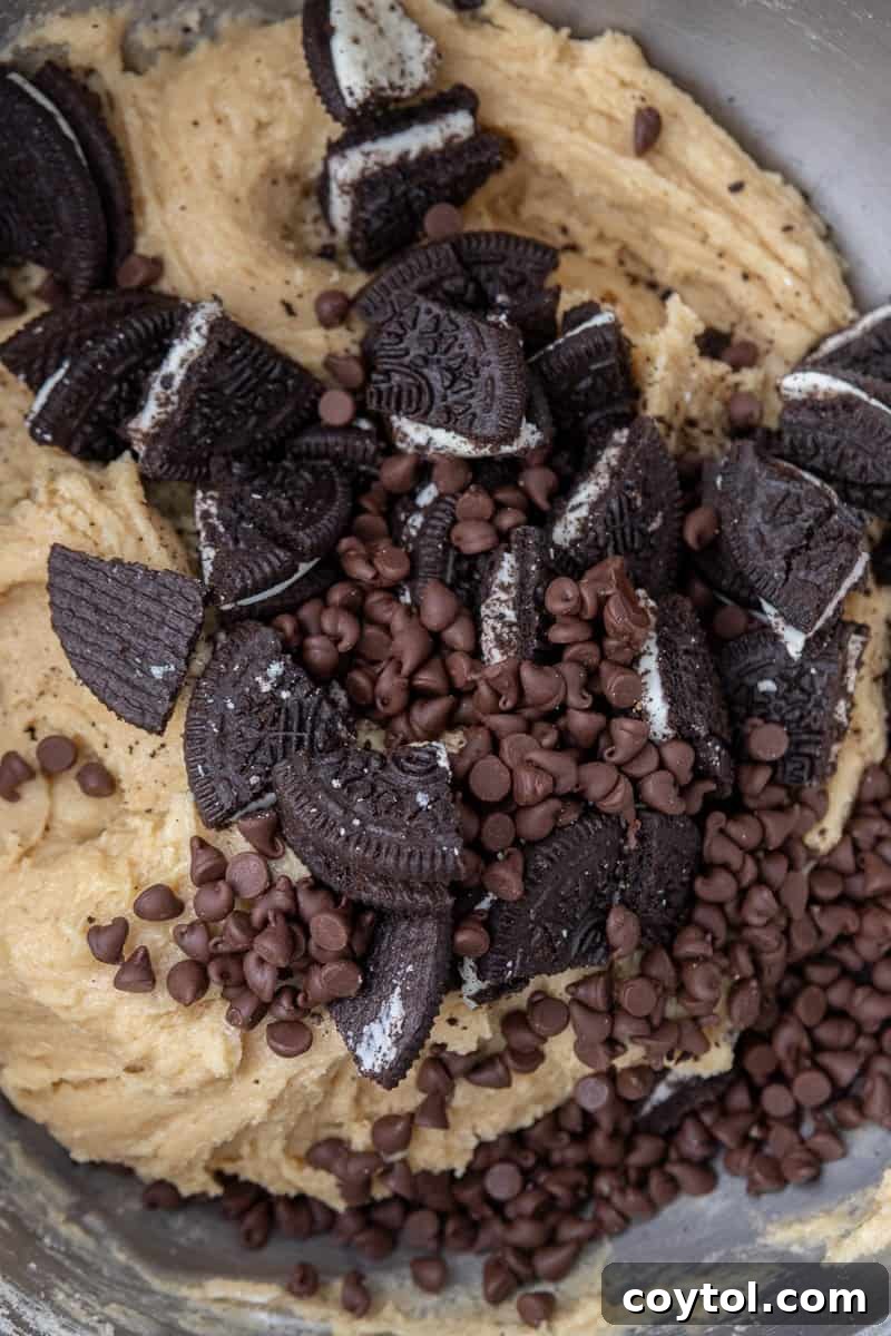 Simple Skillet Oreo Cookies and Cream Pizookie 5 Cookie dough with chocolate chips and chopped Oreos folded in.