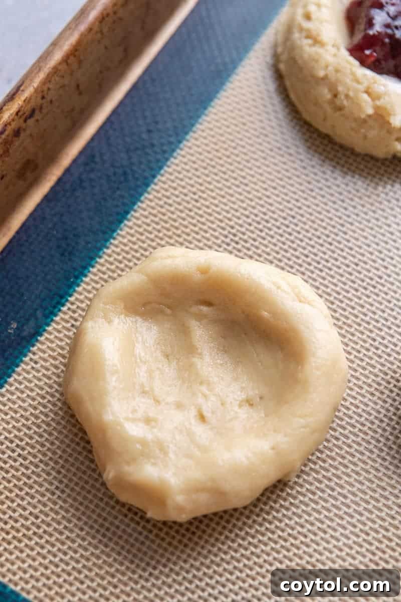 Cookie dough ball with a well created in the center