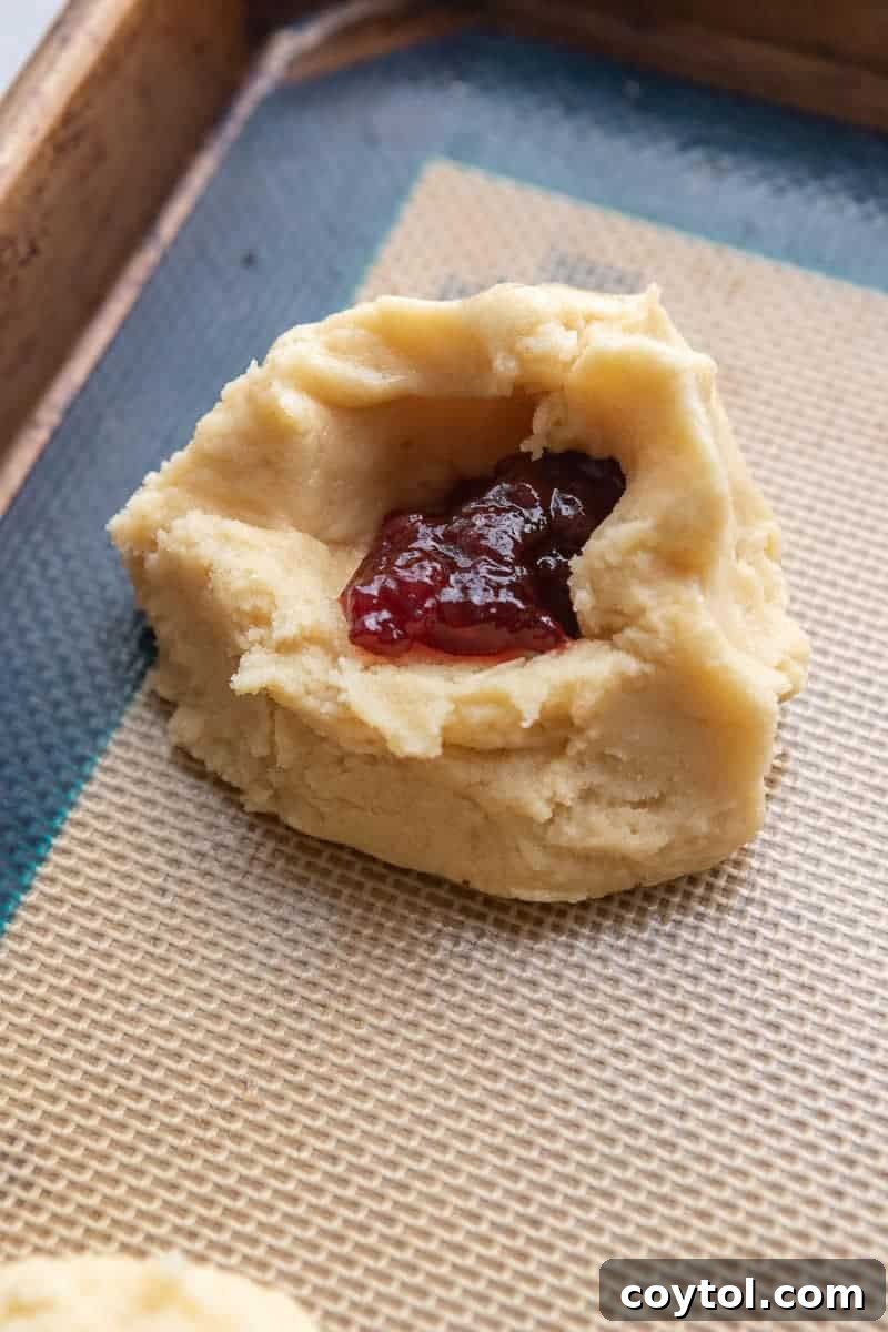Sealed cookie dough ball with jam inside