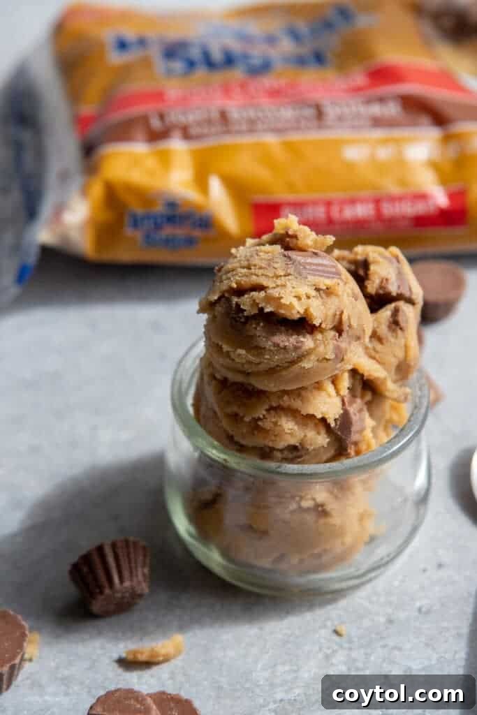 Cookie dough in a cookie scoop with Reese's pieces