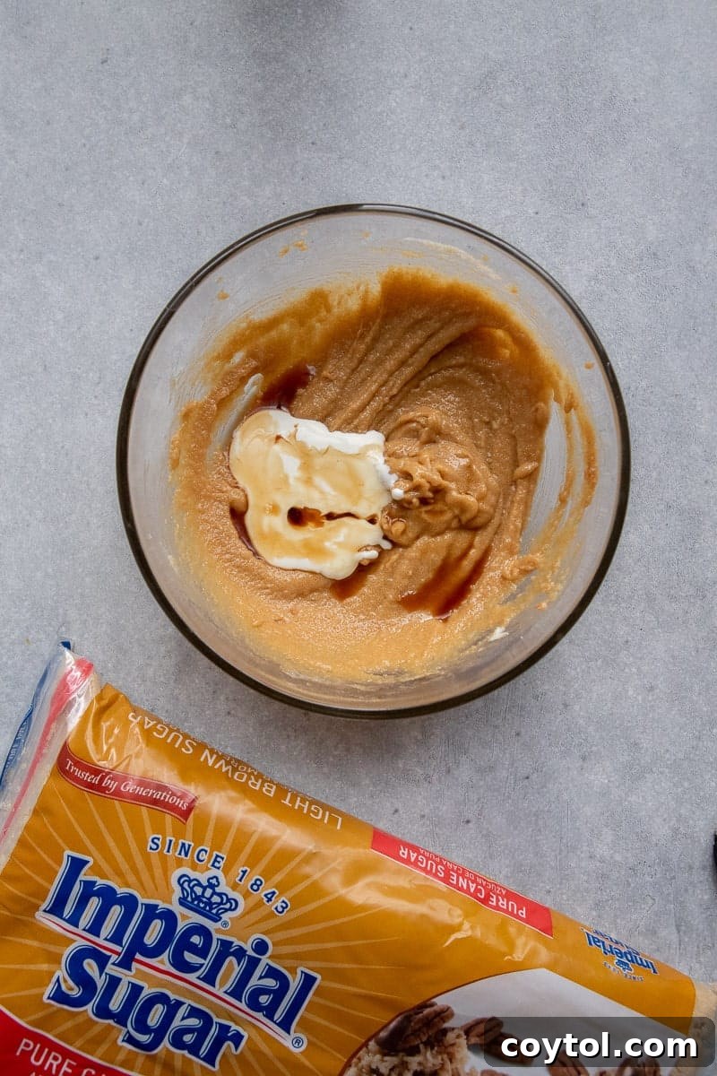 Creamed butter and sugar in a bowl, showing the initial mixing step