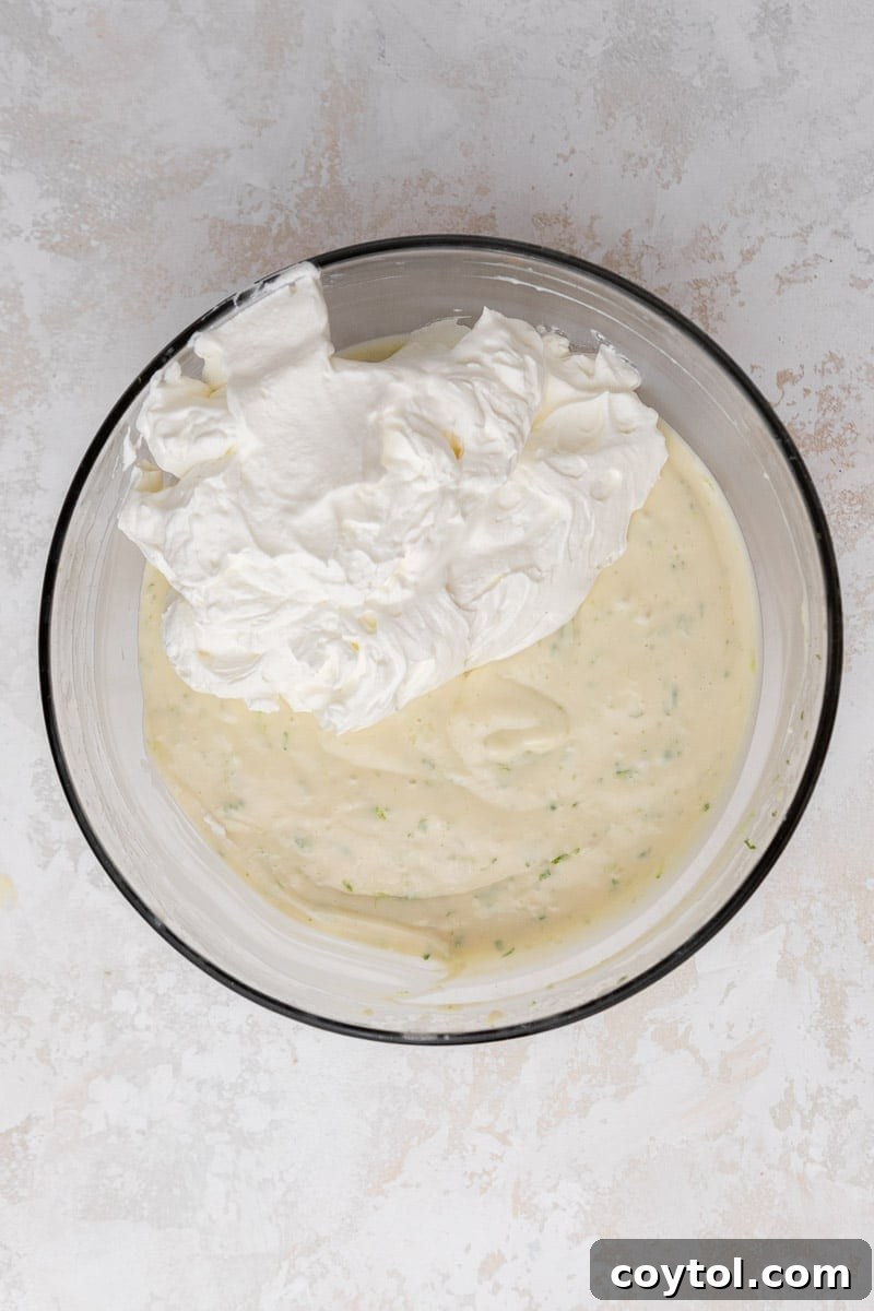 Pie filling with whipped cream on top before mixing