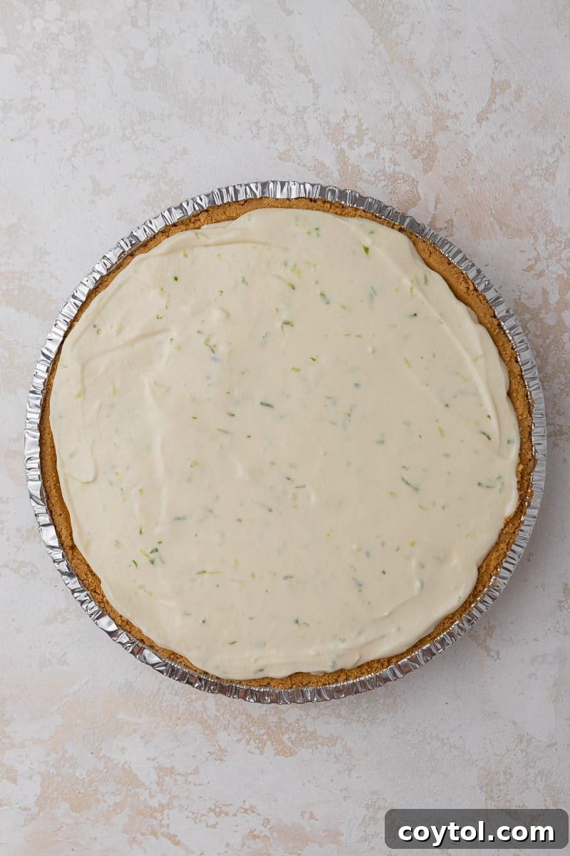 Key lime pie poured into crust before chilling
