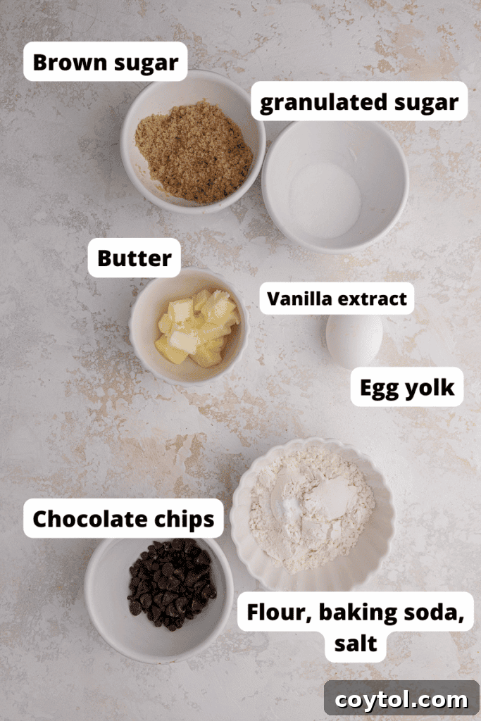 The Ultimate Single Serve Chocolate Chip Cookie Recipe 3 Ingredients for a single serve chocolate chip cookie laid out on a white surface