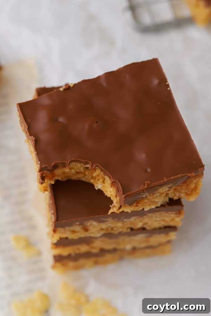 Irresistible Scotcharoos: The Perfect No-Bake Treat 3 Stack of Scotcheroos with thick chocolate layer on top