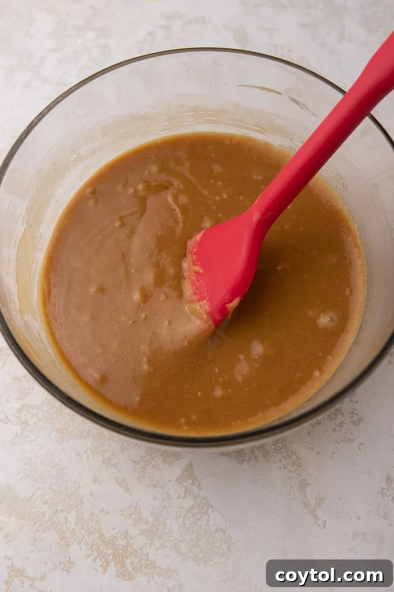 Irresistible Scotcharoos: The Perfect No-Bake Treat 6 Wet ingredients in a bowl