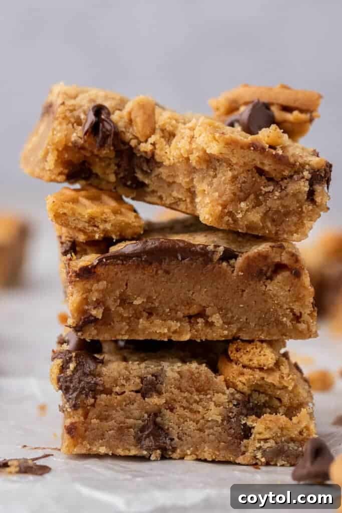 Close-up of perfectly stacked Nutter Butter cookie bars, showcasing their chewy texture and embedded cookie pieces.