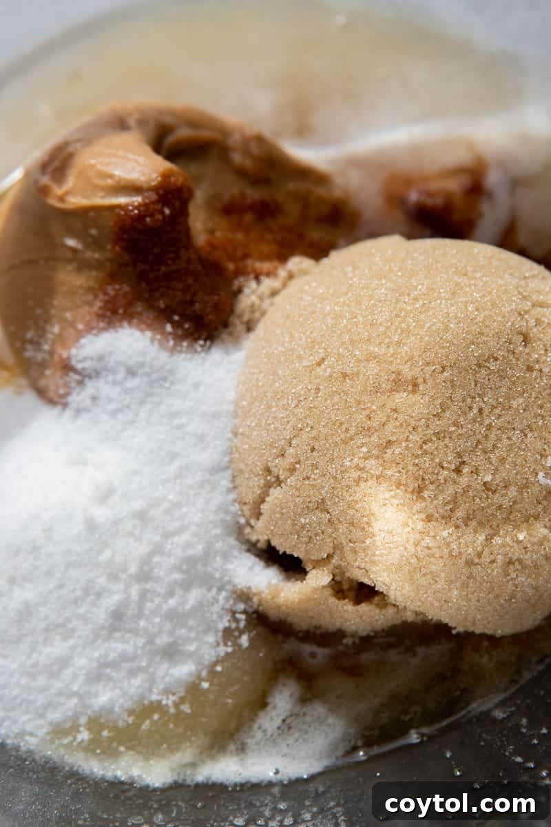 Mixing wet ingredients in a bowl, showcasing the creamy texture before adding dry components.