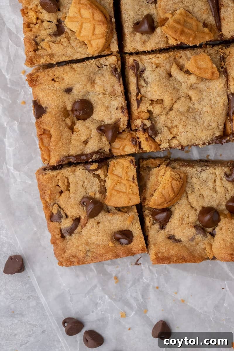 A fresh batch of golden-brown Nutter Butter bars in the pan, straight from the oven.