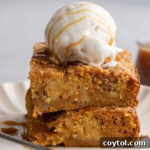 Stack of pumpkin dump cake with ice cream on top