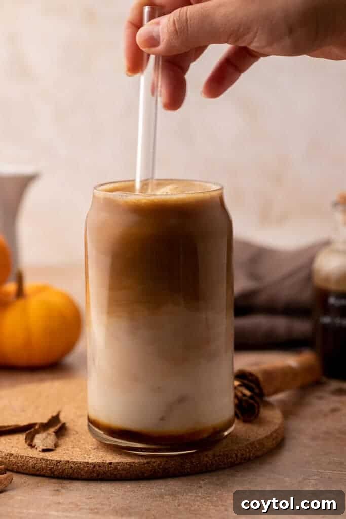 A freshly made pumpkin spice latte with whipped cream and cinnamon