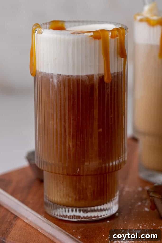 Craft Your Own Starbucks Salted Caramel Cold Foam Cold Brew 9 Close-up of coffee marbling beautifully with salted caramel cold foam