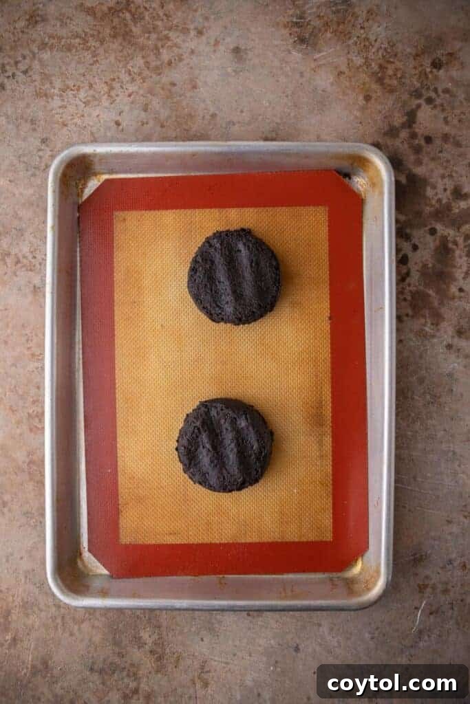 Crumbl's Mallow Oreo Dream Sandwich 7 Cookie dough balls in a baking sheet