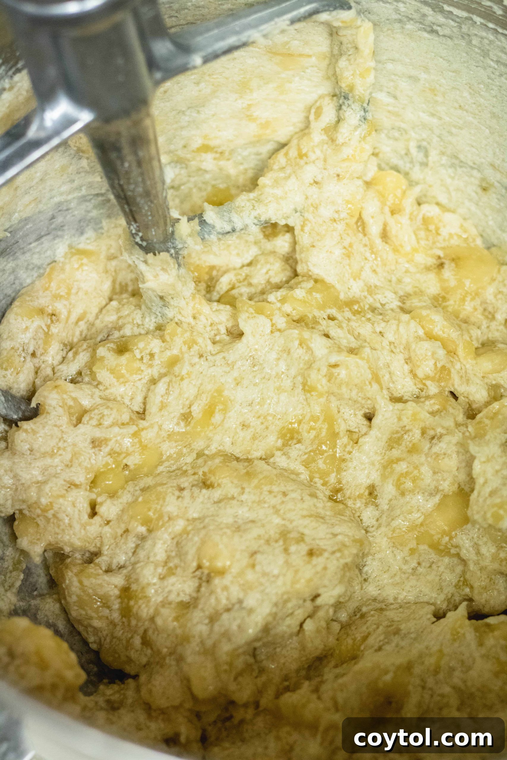 Sky high banana nut muffins batter after adding bananas.