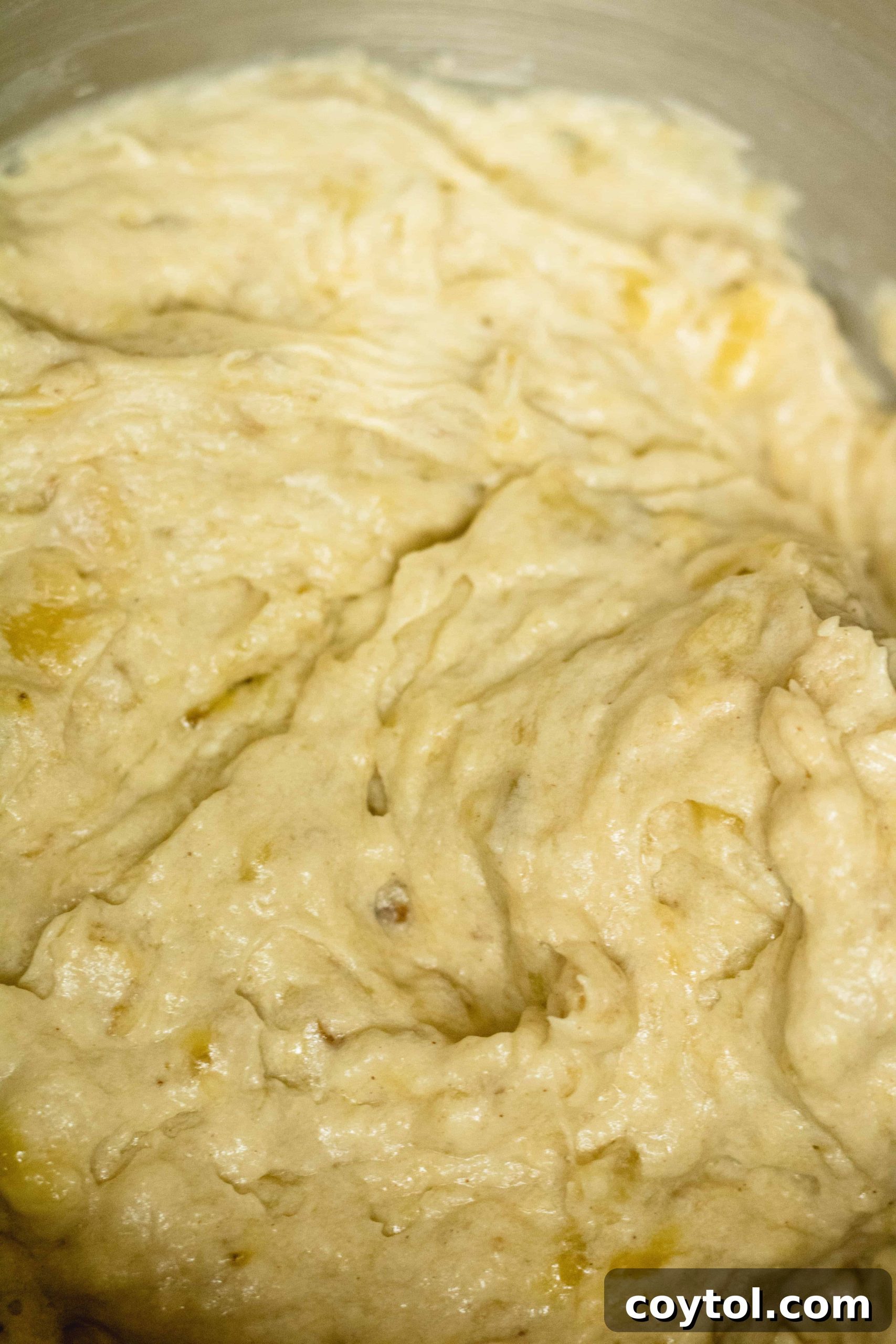 Sky high banana nut muffins batter ready for baking.